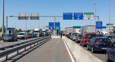 European border checkpoint with road barriers